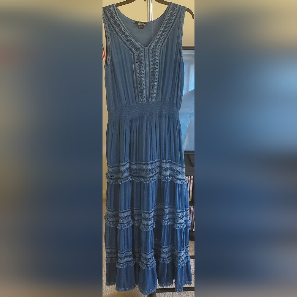 Very light denim-like dress. Well embroidered and embellished. Never worn.